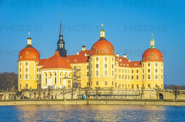 Exterior view of Moritzburg Castle in winter with half-frozen castle pond from the southwest