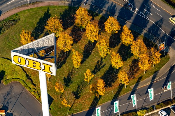 Autumn trees at Obi Markt from the air in Recklinghausen. North Rhine-Westphalia