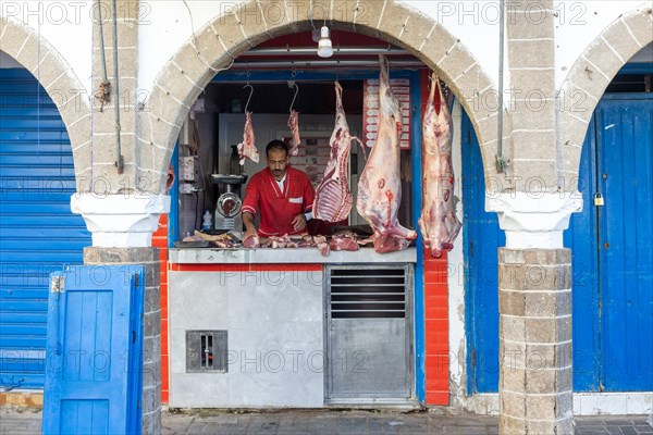 Meat hanging on hook at butcher shop in medina area of Essaouira