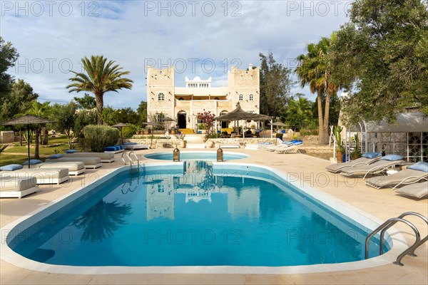 Out of Medina riad hotel swimming pool and building