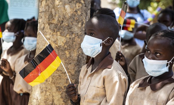 Children wearing nose-mouth protection in a school in Africa