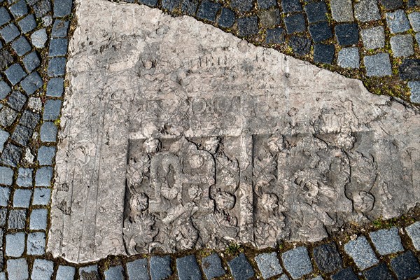 Historic gravestones in the pavement in front of St. Nicholas Church