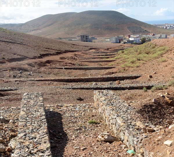 Check dams crossing valley to control risk of flash flooding down steep hillside