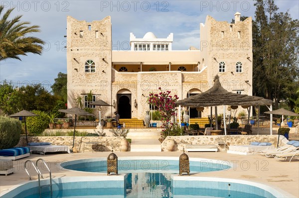 Out of Medina riad hotel swimming pool and building