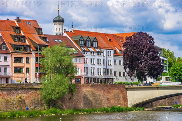 The Danube front with house facades and parts of the historic city wall at the height of the Herdbruecke