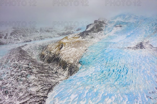 Aerial view in winter over the glacier Falljoekull