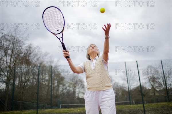 Subject: Woman aged 82 standing on the tennis court