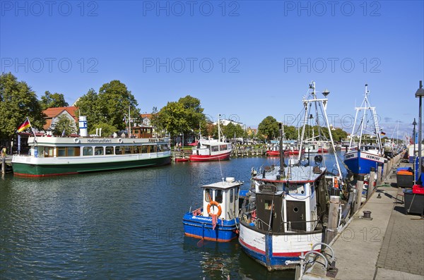 Fishing boats and excursion ships at the Alter Strom in Rostock-Warnemuende