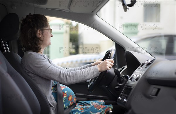 Subject: Pregnant woman driving a car