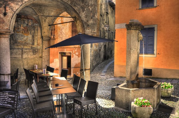 Water Well and Table with Chairs in Cannobio