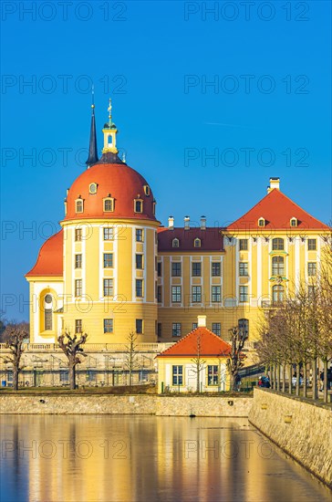 Exterior view of Moritzburg Castle in winter with half-frozen castle pond from the south