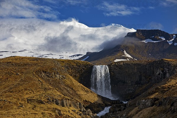 The Snaefellsjoekull with the Svoedufoss waterfall