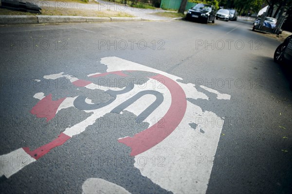 A weathered lettering for a speed 30 zone