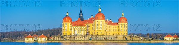 Exterior view of Moritzburg Castle in winter with half-frozen castle pond from the southwest