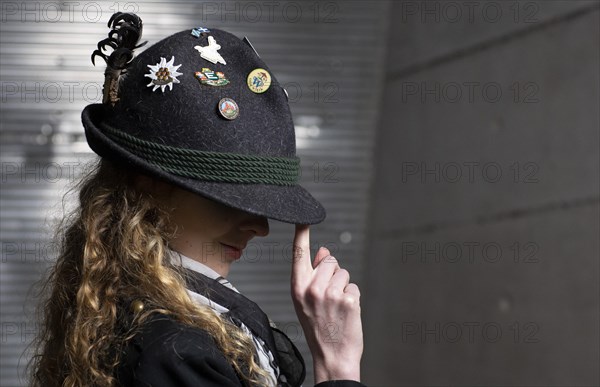 Young woman with a traditional loden hat