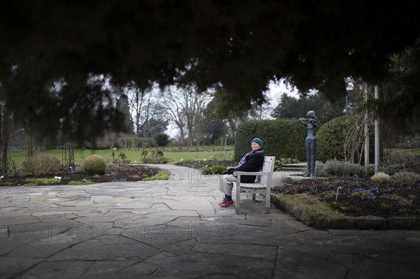 Subject: Pensioner on a park bench in Westfalenpark in Dortmund