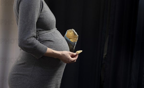 Pregnant woman with chips