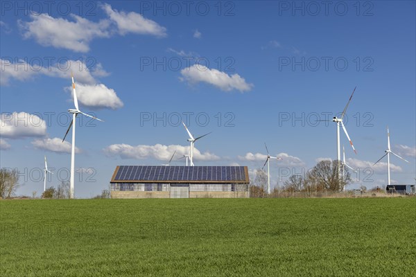 Solar modules on a stable and wind turbines in Brandenburg