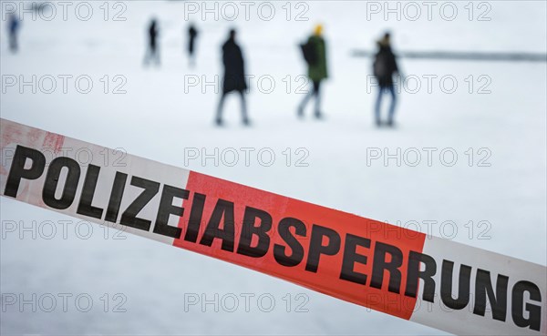 People walk on the frozen Landwehrkanal in Berlin. 11.02.2021.