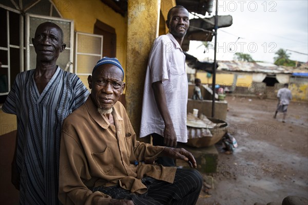 Three men in Bomeh Village at the KissyRoad dumpsite