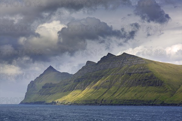 Sea cliffs along the rugged coast of Eysturoy