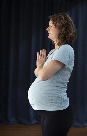 Pregnant woman doing yoga