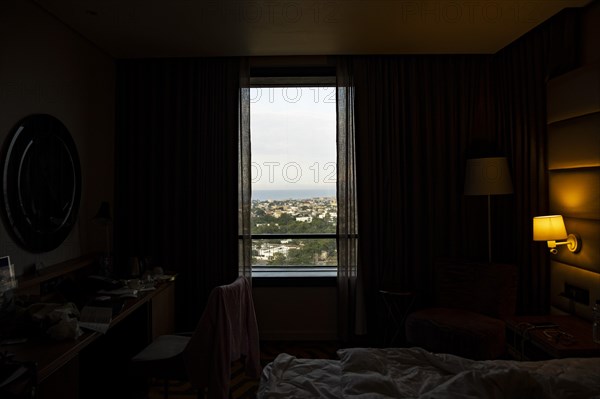 City view of Lome photographed through a window