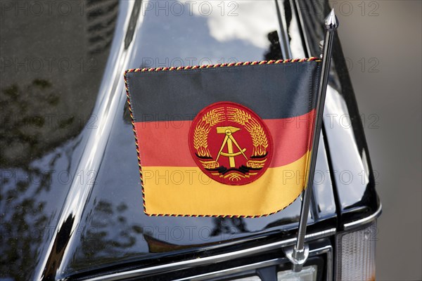 National flag of the GDR on a state coach Volvo 264 TE