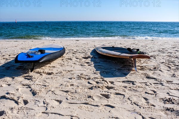 Two surfboards on the beach of Hoernum on the island of Sylt