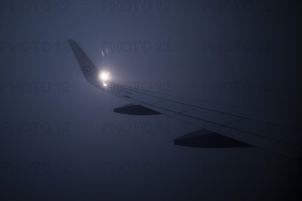 A Lufthansa aircraft flying to Frankfurt in fog