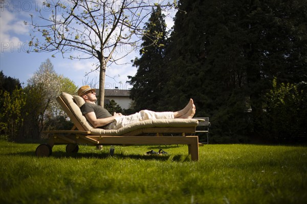 Subject: Relaxation on a lounger in the spring.