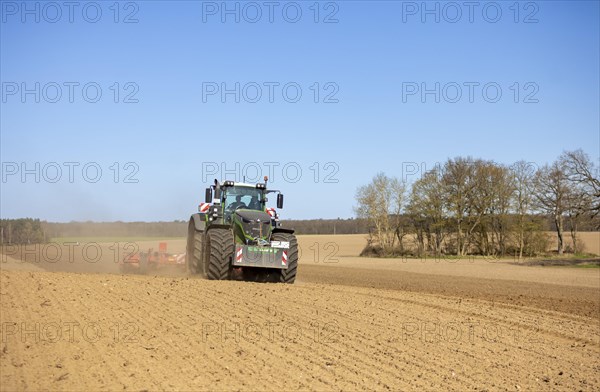 Soil cultivation for maize sowing with tractor Fendt 1050