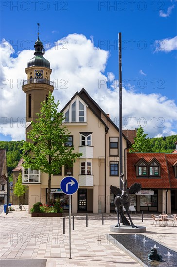 Inanimate street scene with sculptures from the artistic collaboration Excavations by Peter Lenk with Miriam Lenk and view of St. Martin's Church in the Obere Vorstadt