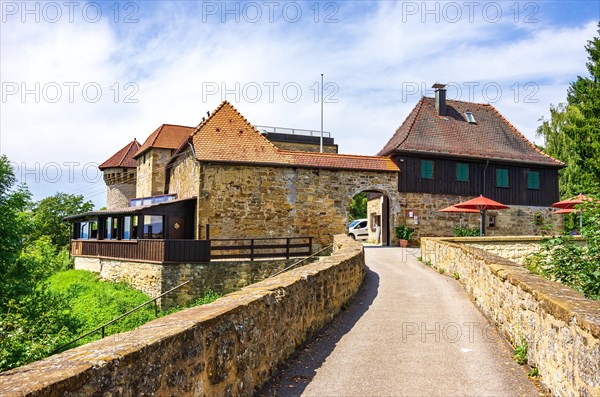 Hohenrechberg castle ruins with castle tavern in front of it in Rechberg