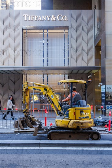 Construction machine in front of Tiffany and Co