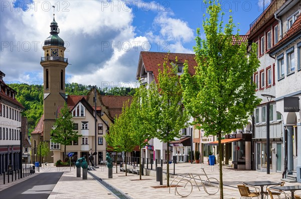 Inanimate street scene with sculptures from the artistic collaboration Excavations by Peter Lenk with Miriam Lenk and view of St. Martin's Church in the Obere Vorstadt