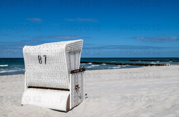 Single beach chair on the sandy beach of Ahrenshoop