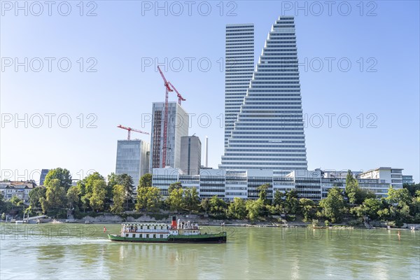 Excursion boat on the Rhine and the Roche Tower or Roche Tower