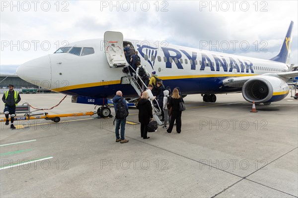 Passengers boarding Ryanair airline Boeing 737 plane