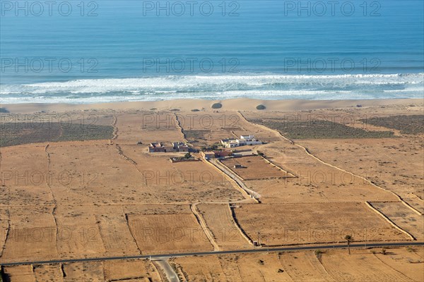 View over coastal plain to Atlantic Ocean coastline from Tamellalt