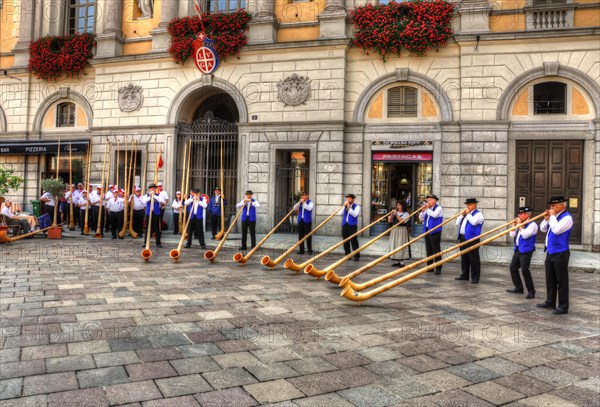 Group of People Making Music with Swiss Horn in Lugano