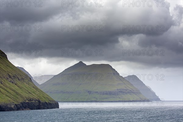 Sea cliffs along the rugged coast of Eysturoy