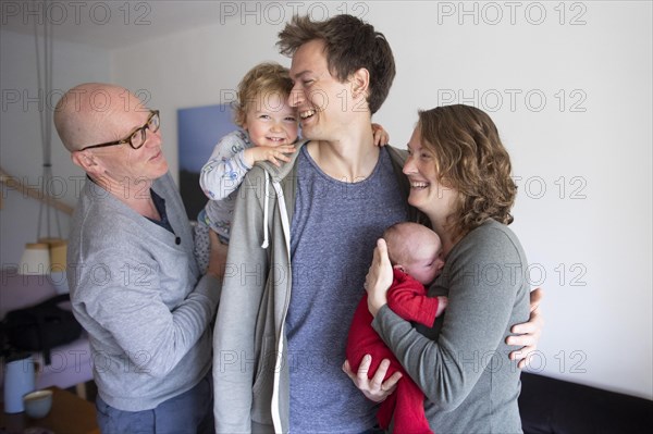 Subject : Family. Grandfather with young family