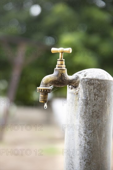 Water. Water bucket and dripping tap in Lome