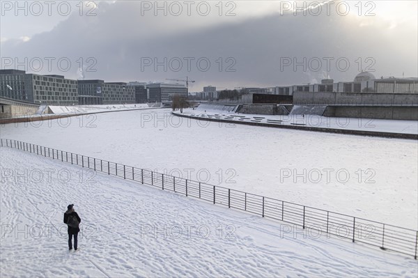 The Reichstag building stands out in the sunshine after heavy snowfall in the government district in Berlin