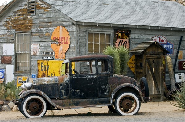 Old Ford vintage car along the Route 66 at the general store of the ghost town Hackberry in Arizona