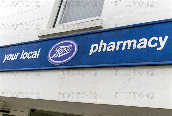 Boots Your Local Pharmacy sign outside chemist shop