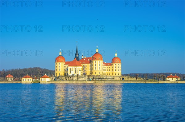 Exterior view of Moritzburg Castle in winter with half-frozen castle pond from the southwest