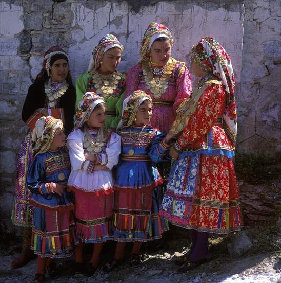 Girls decorated with gold coins