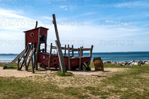 Climbing frame in the shape of a ship on a playground on the beach